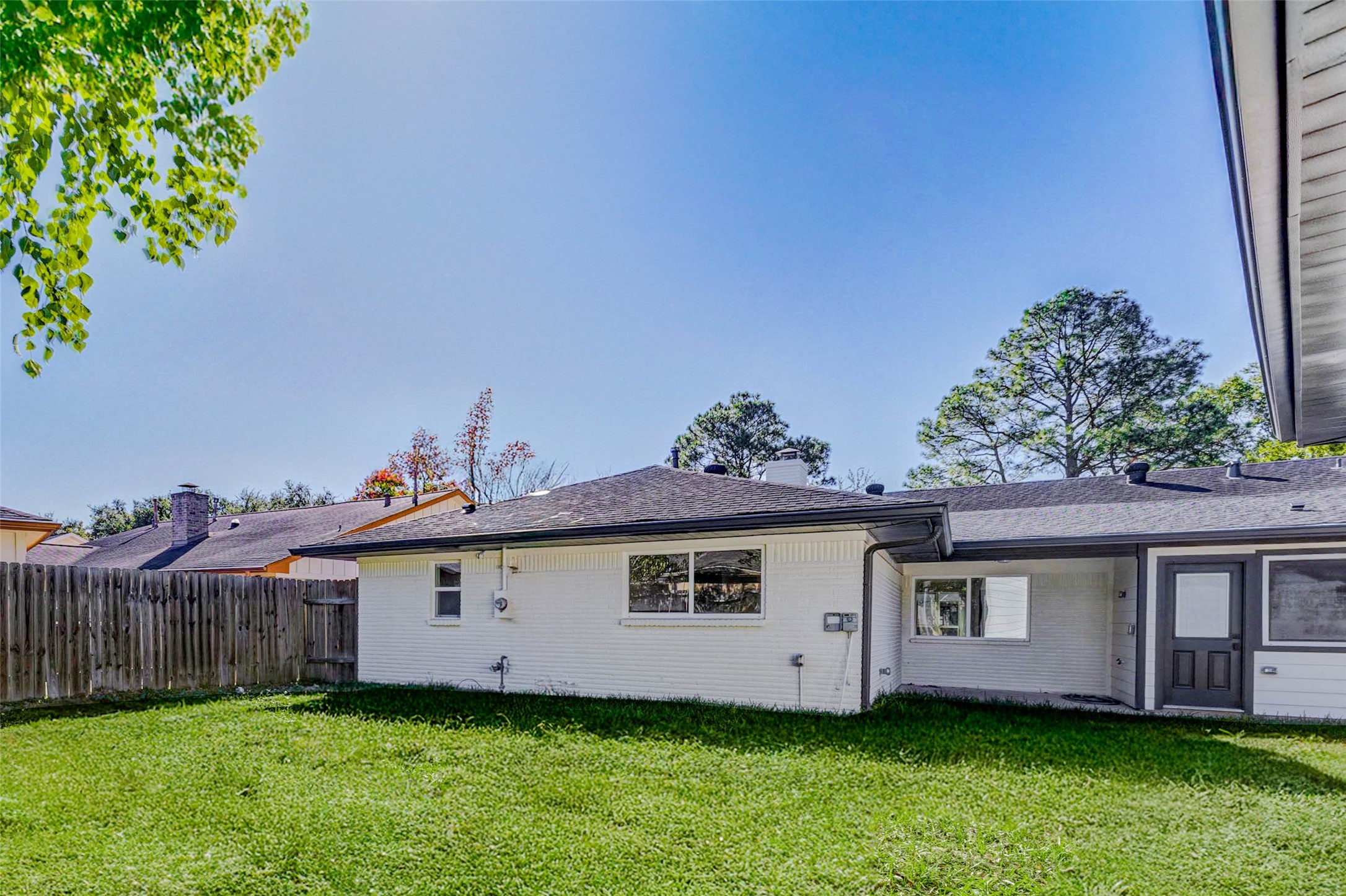 6106 Rutherglenn Drive Houston, TX 77096 - Photo 39 of 43 a view of a house with a yard and a fence