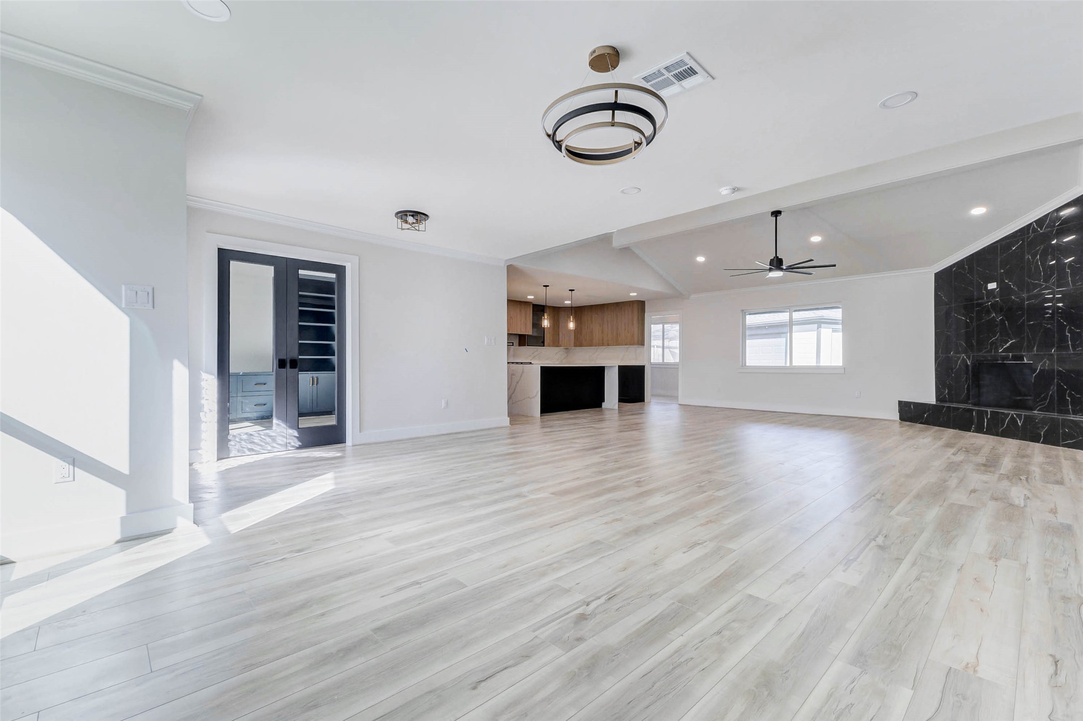 6106 Rutherglenn Drive Houston, TX 77096 - Photo 8 of 43 a view of empty room with wooden floor and window