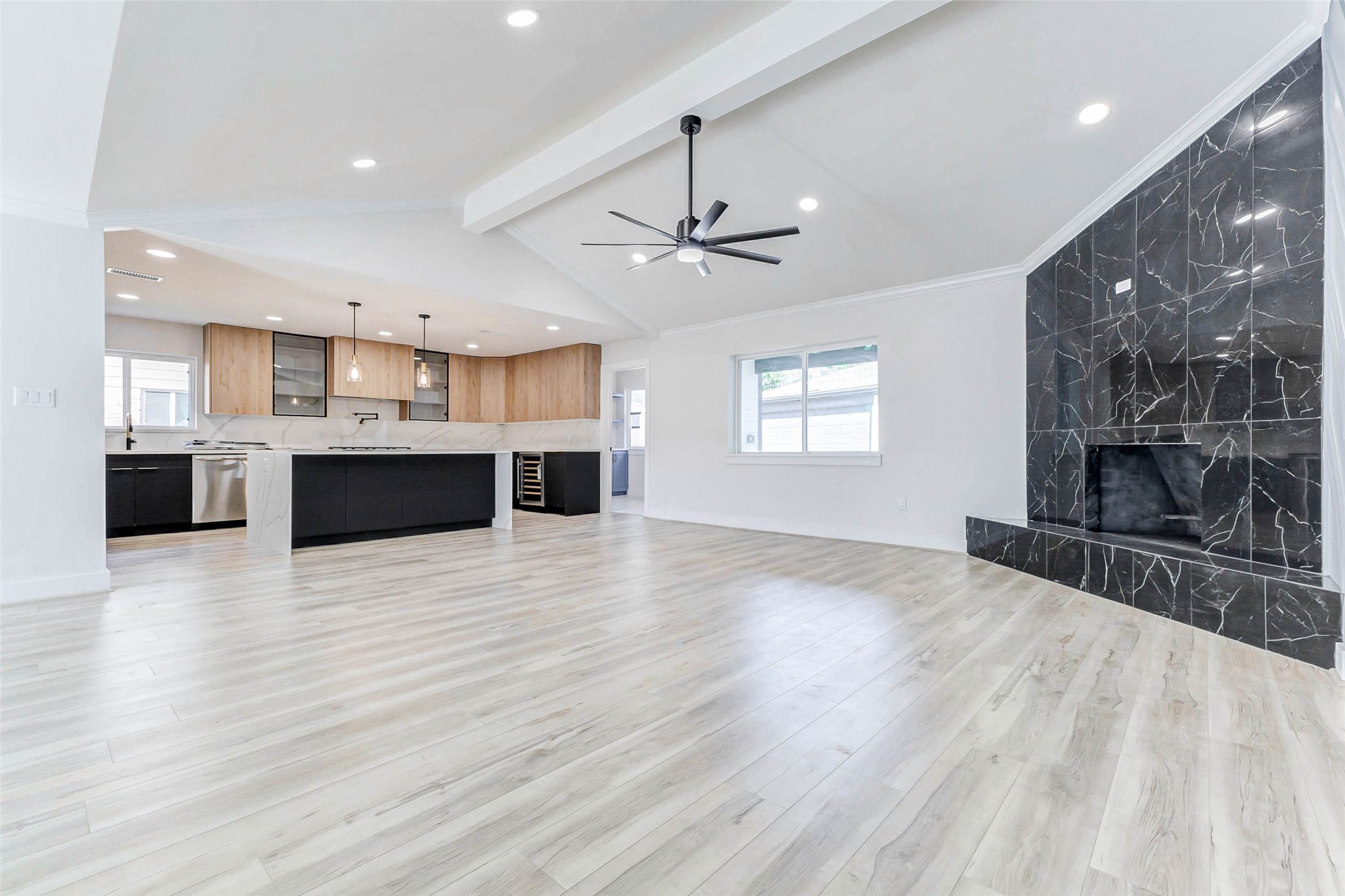 6106 Rutherglenn Drive Houston, TX 77096 - Photo 9 of 43 a view of a kitchen with furniture and a ceiling fan