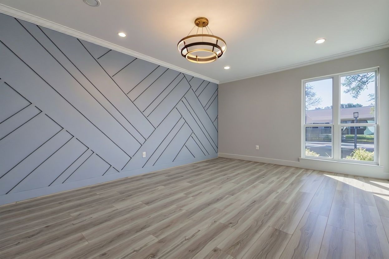6106 Rutherglenn Drive Houston, TX 77096 - Photo 10 of 43 wooden floor in an empty room with a window