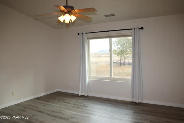a view of door with wooden floor