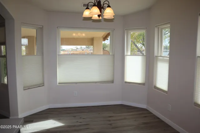 a large kitchen with stainless steel appliances granite countertop a stove a sink dishwasher and a refrigerator