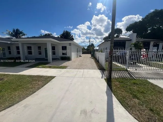 a view of a house with brick walls and a chandelier