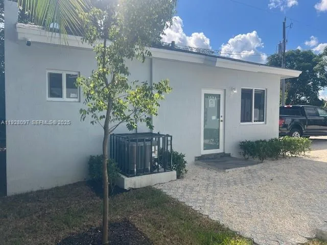 a house view with a garden space
