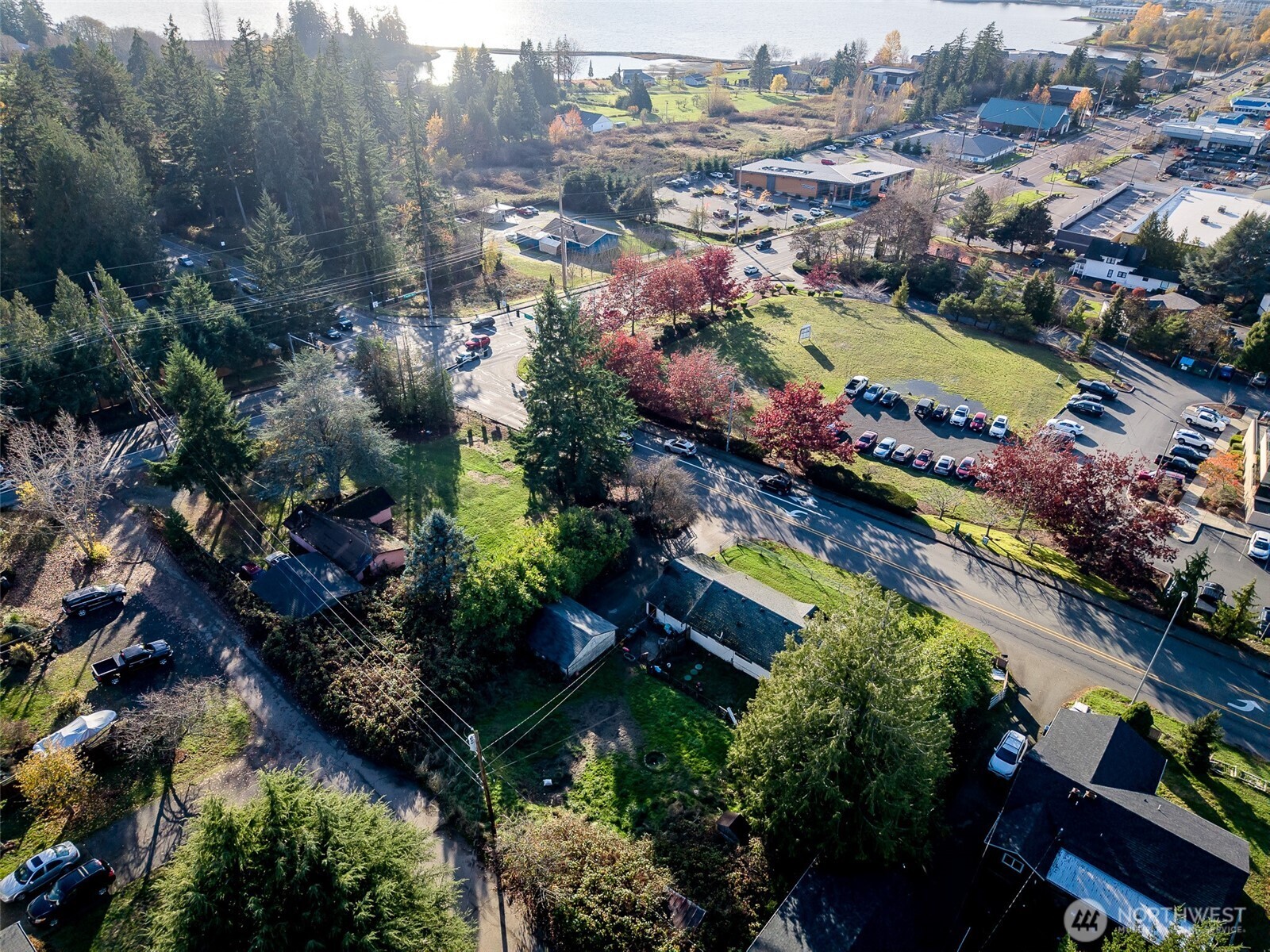 an aerial view of lake residential house with swimming pool and green space