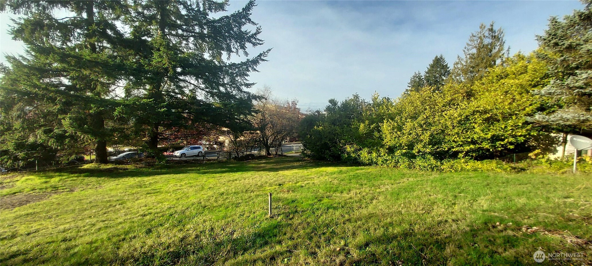 1998 Northwest Bucklin Hill Road Silverdale, WA 98383 - Photo 11 of 17 a view of a swimming pool and trees in the background