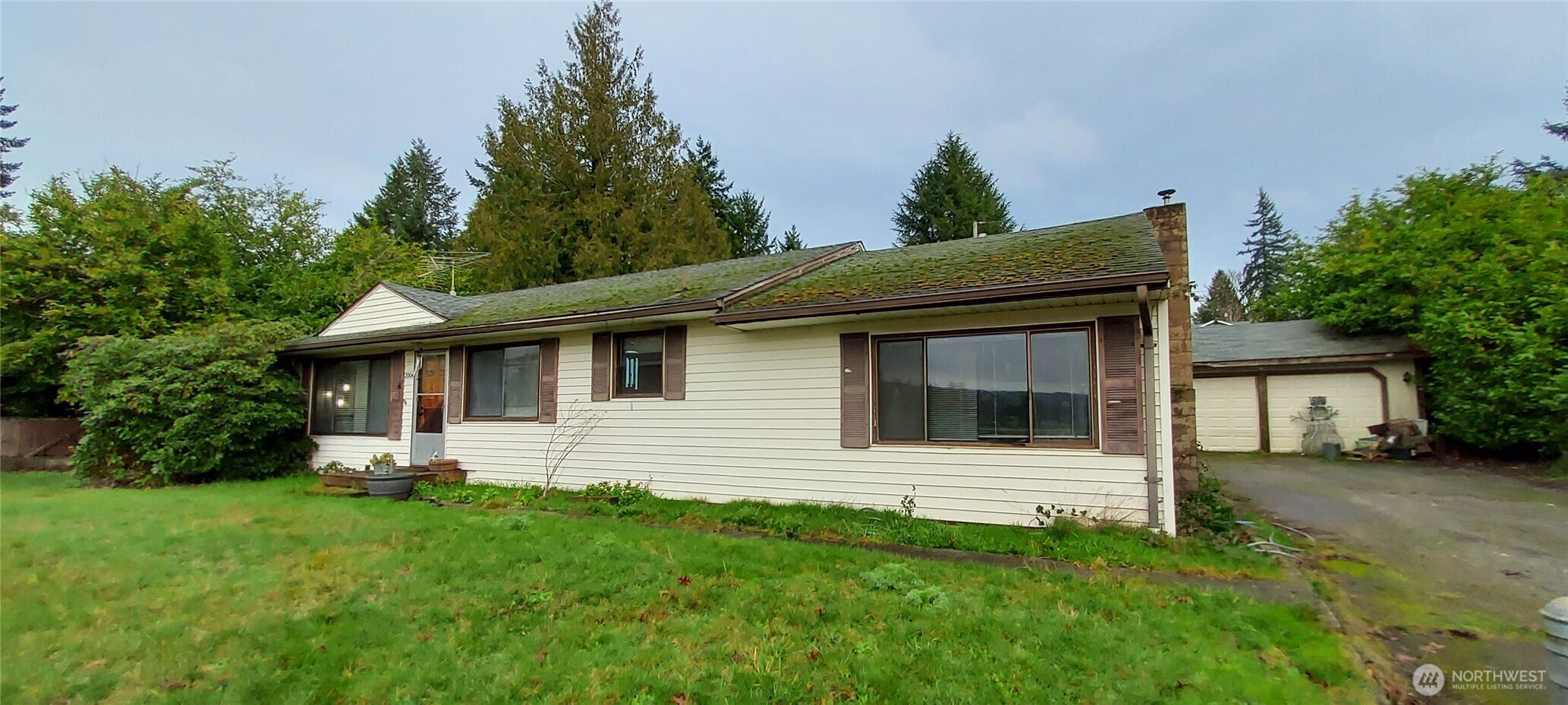 1998 Northwest Bucklin Hill Road Silverdale, WA 98383 - Photo 18 of 27 a view of a house with a yard