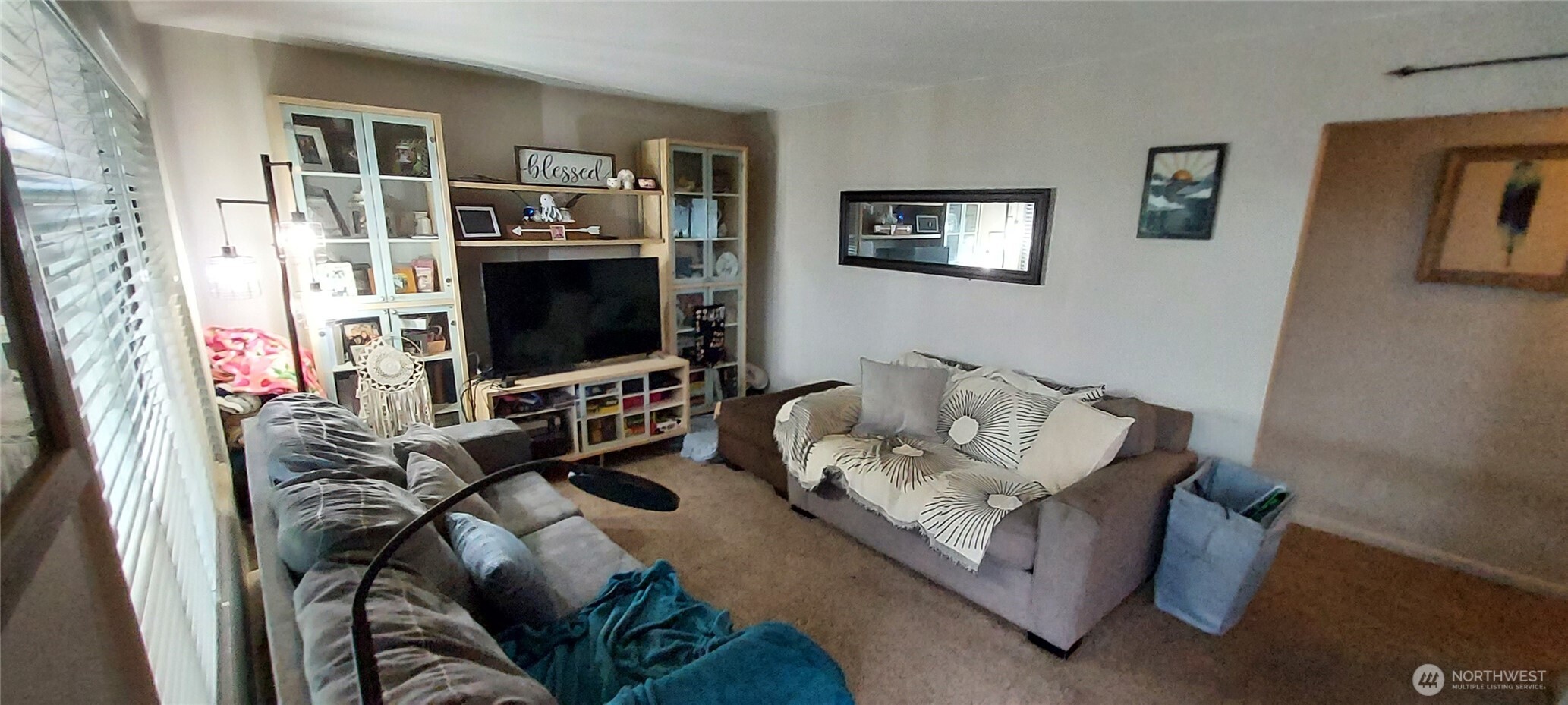 1998 Northwest Bucklin Hill Road Silverdale, WA 98383 - Photo 19 of 27 a living room with furniture and a flat screen tv
