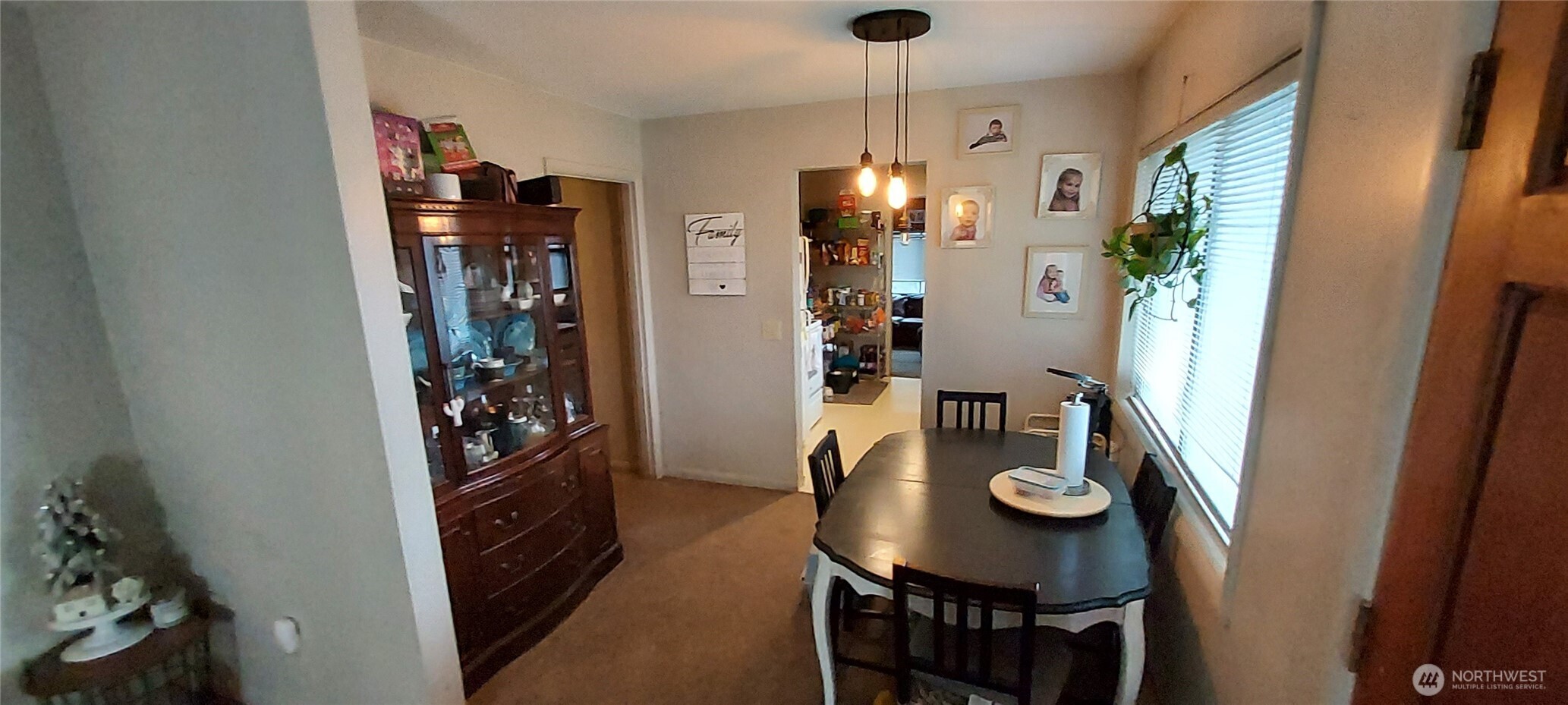 1998 Northwest Bucklin Hill Road Silverdale, WA 98383 - Photo 20 of 27 a view of kitchen island with furniture and refrigerator