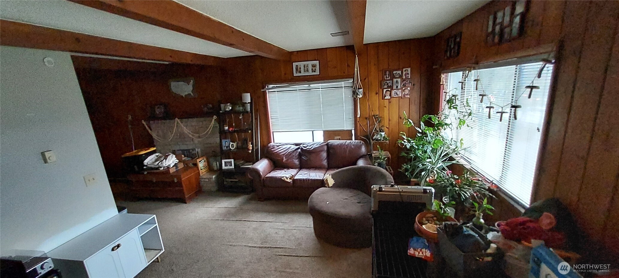 1998 Northwest Bucklin Hill Road Silverdale, WA 98383 - Photo 21 of 27 a living room with furniture and a potted plant