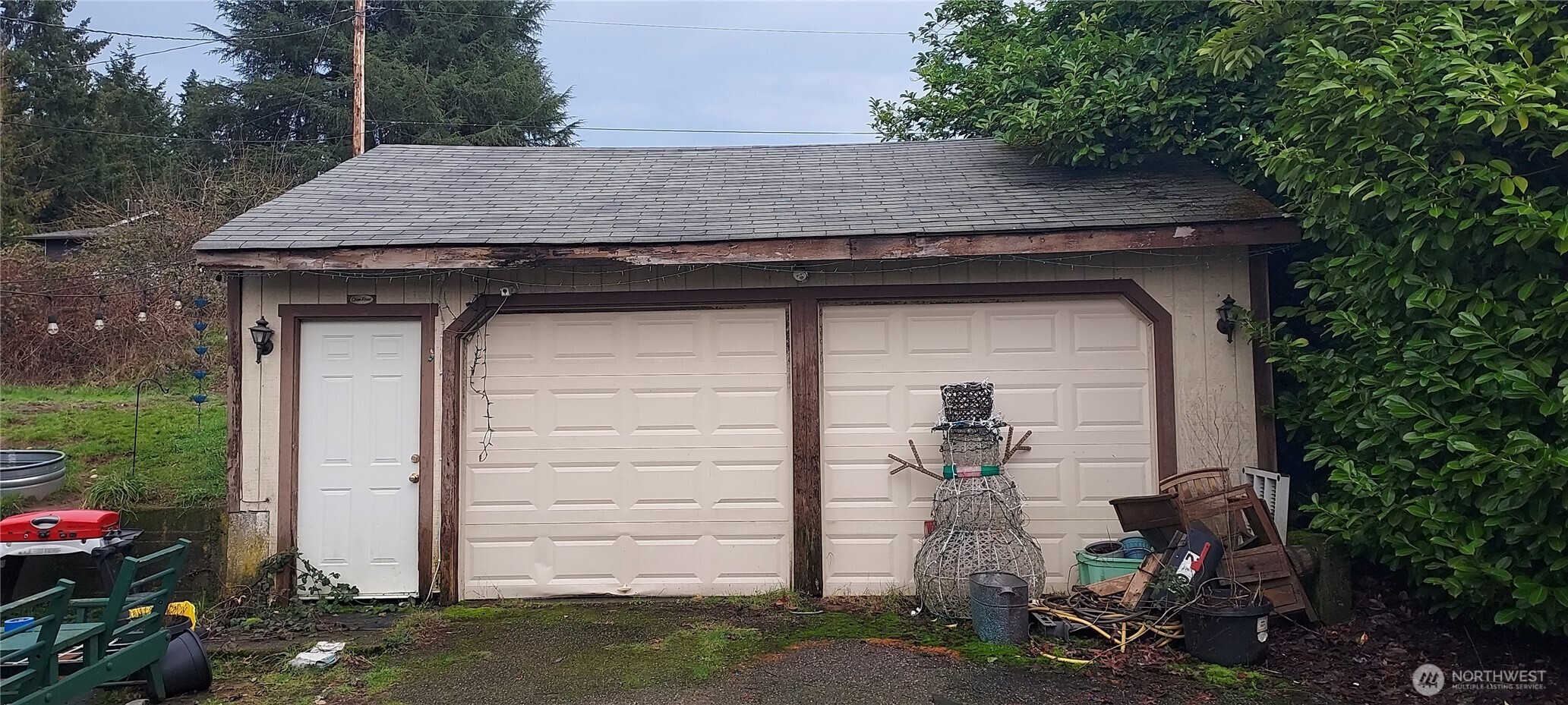 1998 Northwest Bucklin Hill Road Silverdale, WA 98383 - Photo 27 of 27 a front view of a house with garden