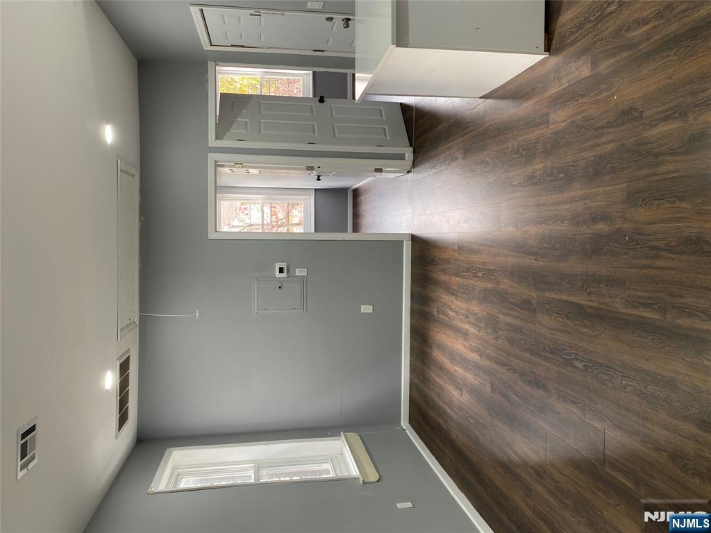 540 South 20th Street, Unit 2 Newark, NJ 07103 - Photo 6 of 13 an empty room with wooden floor and windows
