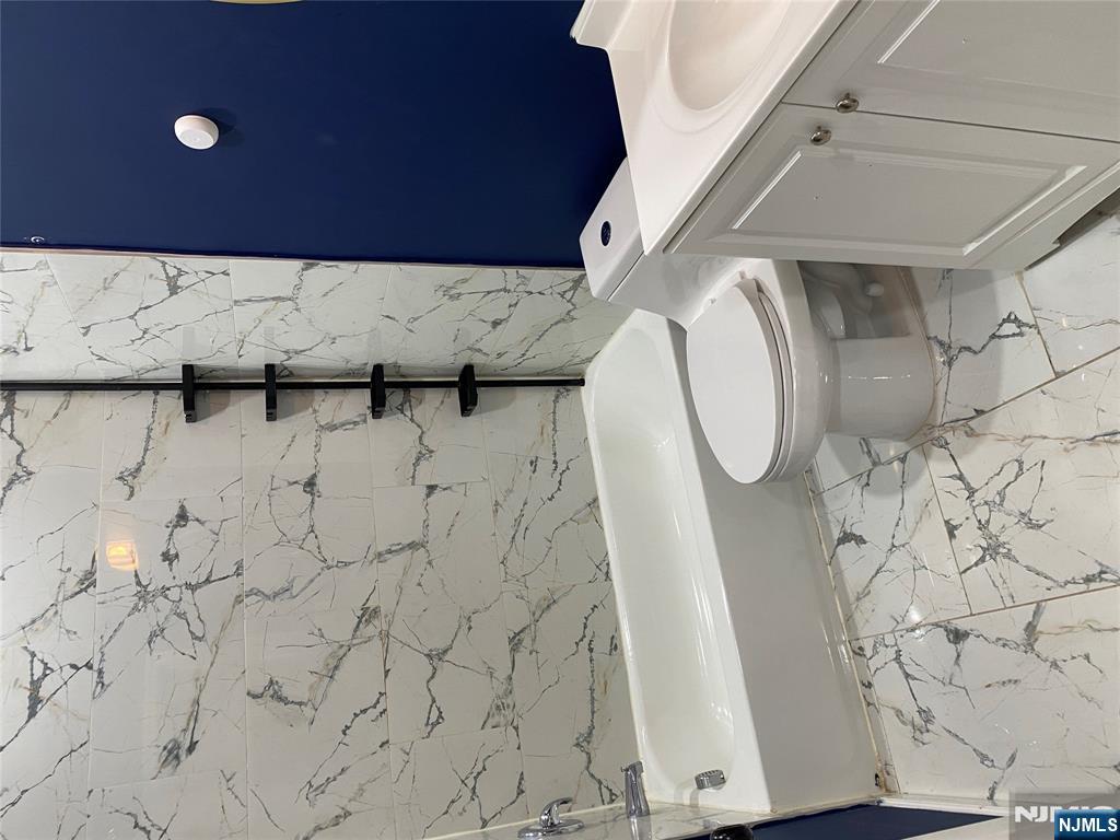 540 South 20th Street, Unit 2 Newark, NJ 07103 - Photo 7 of 13 a bathroom with a toilet and a shower