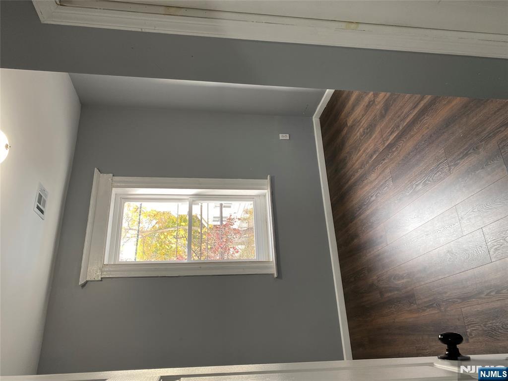 540 South 20th Street, Unit 2 Newark, NJ 07103 - Photo 8 of 13 an empty room with wooden floor and windows