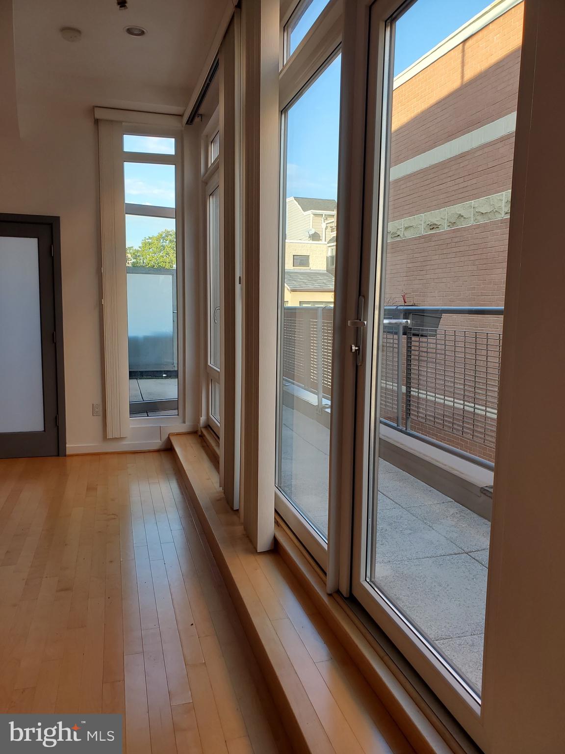 1466 Harvard Street Northwest, Unit PH3 Washington, DC 20009 - Photo 12 of 26 Floor to Ceiling Windows are the entire wall