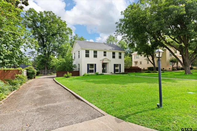 a view of house with yard