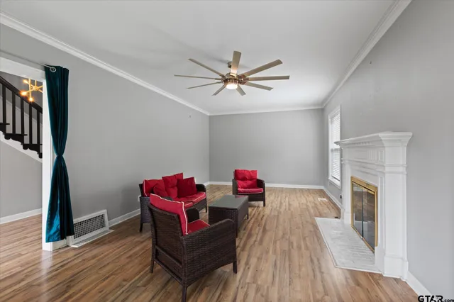 a living room with furniture and a fireplace