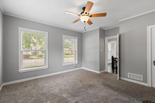 a view of an empty room with a window