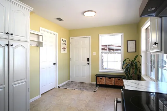 a view of a livingroom with furniture and a window
