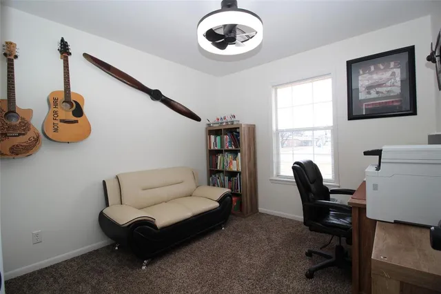 a work room with furniture and windows