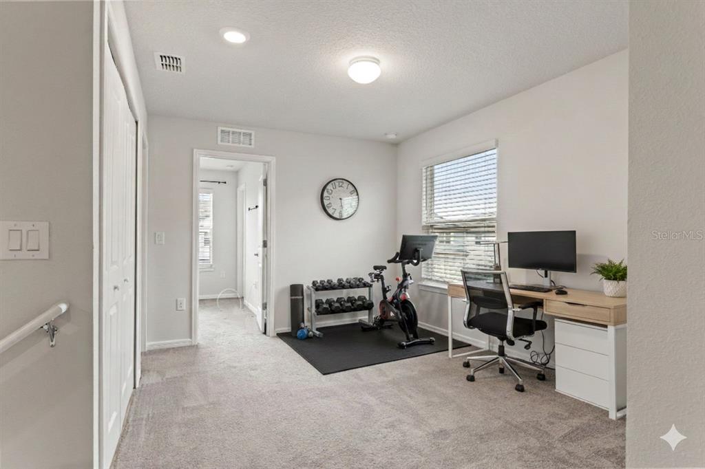 31329 Amberview Bend Wesley Chapel, FL 33545 - Photo 14 of 57 a view of a livingroom with workspace and a window