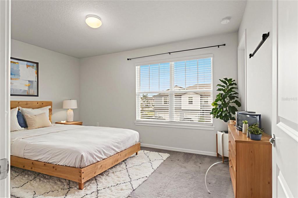 31329 Amberview Bend Wesley Chapel, FL 33545 - Photo 23 of 57 a bedroom with a bed and a window