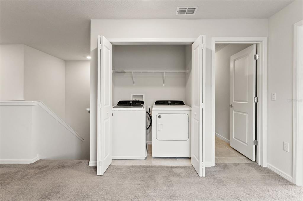 31329 Amberview Bend Wesley Chapel, FL 33545 - Photo 27 of 57 a view of storage and utility room with closet