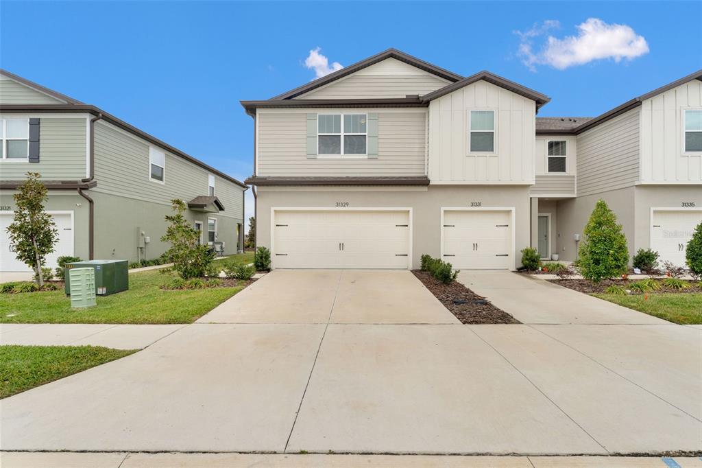 31329 Amberview Bend Wesley Chapel, FL 33545 - Photo 37 of 57 a front view of house with yard