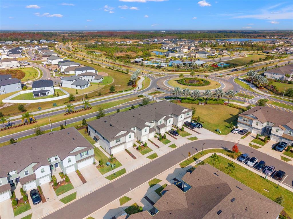 31329 Amberview Bend Wesley Chapel, FL 33545 - Photo 38 of 57 an aerial view of residential houses with outdoor space