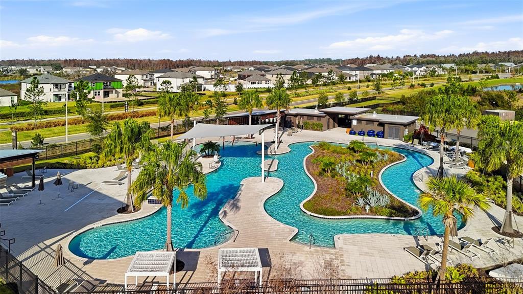 31329 Amberview Bend Wesley Chapel, FL 33545 - Photo 41 of 57 an aerial view of a swimming pool with outdoor seating