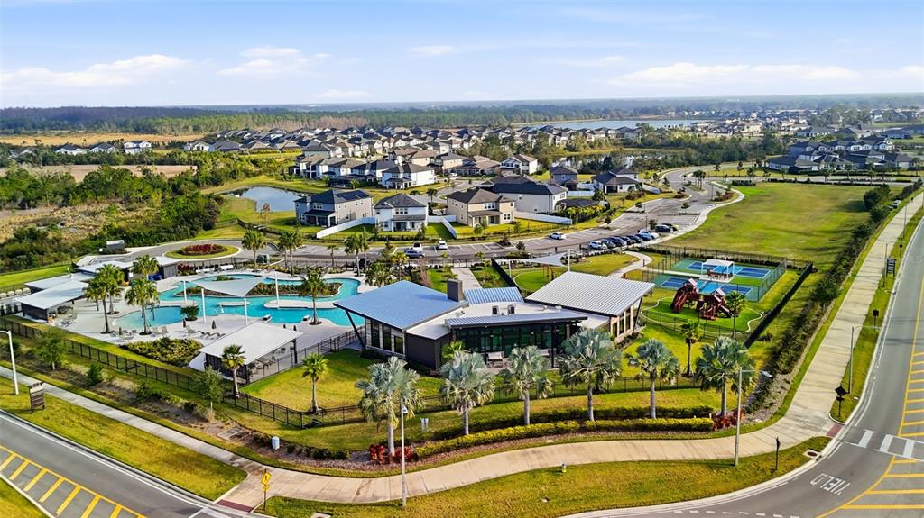 31329 Amberview Bend Wesley Chapel, FL 33545 - Photo 49 of 57 an aerial view of residential houses with outdoor space and swimming pool