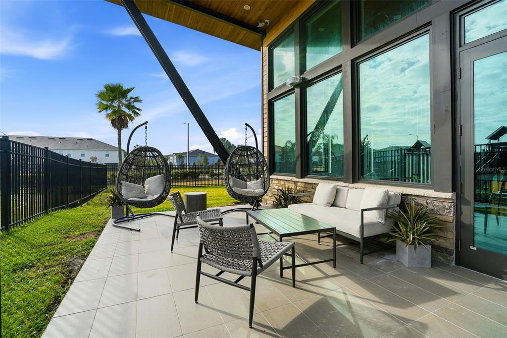 31329 Amberview Bend Wesley Chapel, FL 33545 - Photo 53 of 57 a view of swimming pool with outdoor seating and a garden