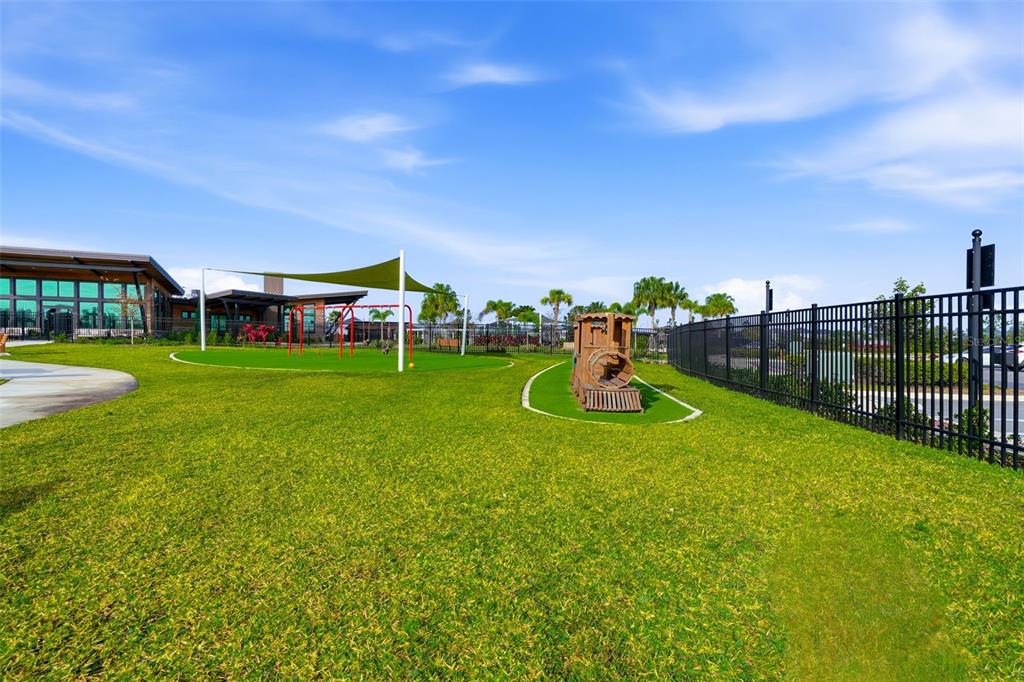 31329 Amberview Bend Wesley Chapel, FL 33545 - Photo 55 of 57 a view of a park with swings and slides