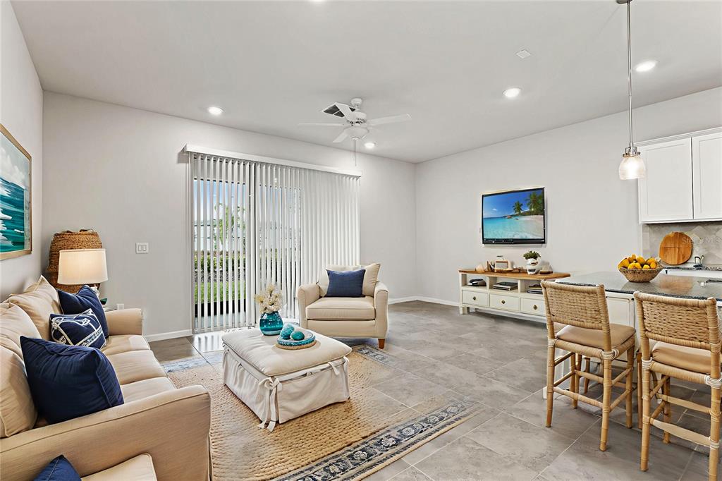 31329 Amberview Bend Wesley Chapel, FL 33545 - Photo 6 of 57 a living room with furniture and a large window