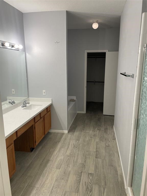 2103 Ragland Drive Houston, TX 77067 - Photo 11 of 18 a bathroom with a sink a mirror and a vanity