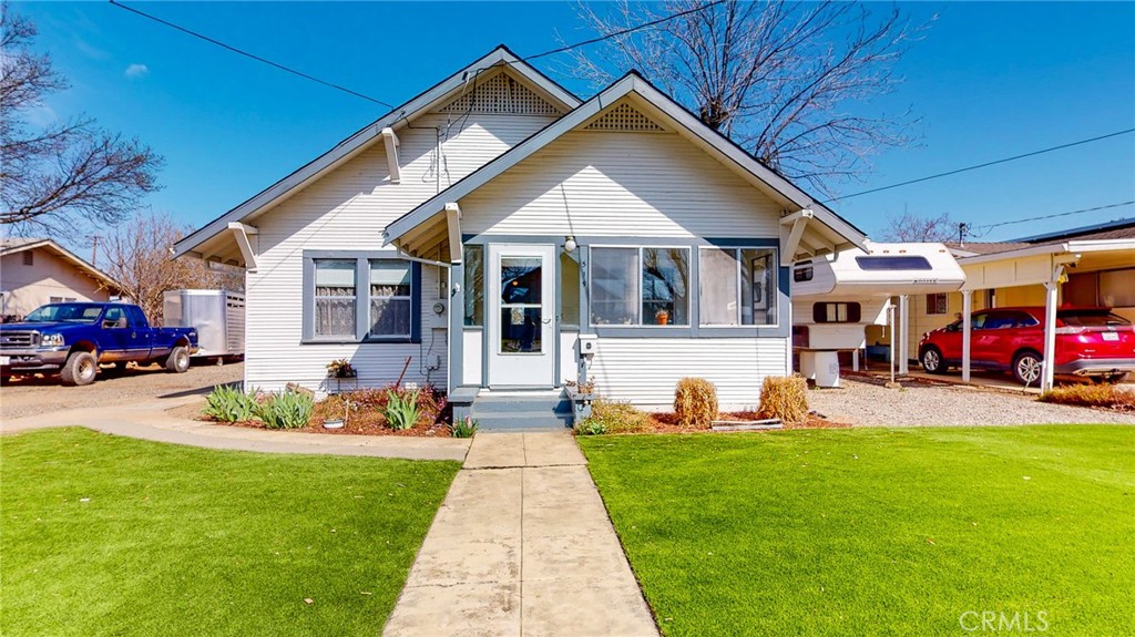 a front view of a house with a yard