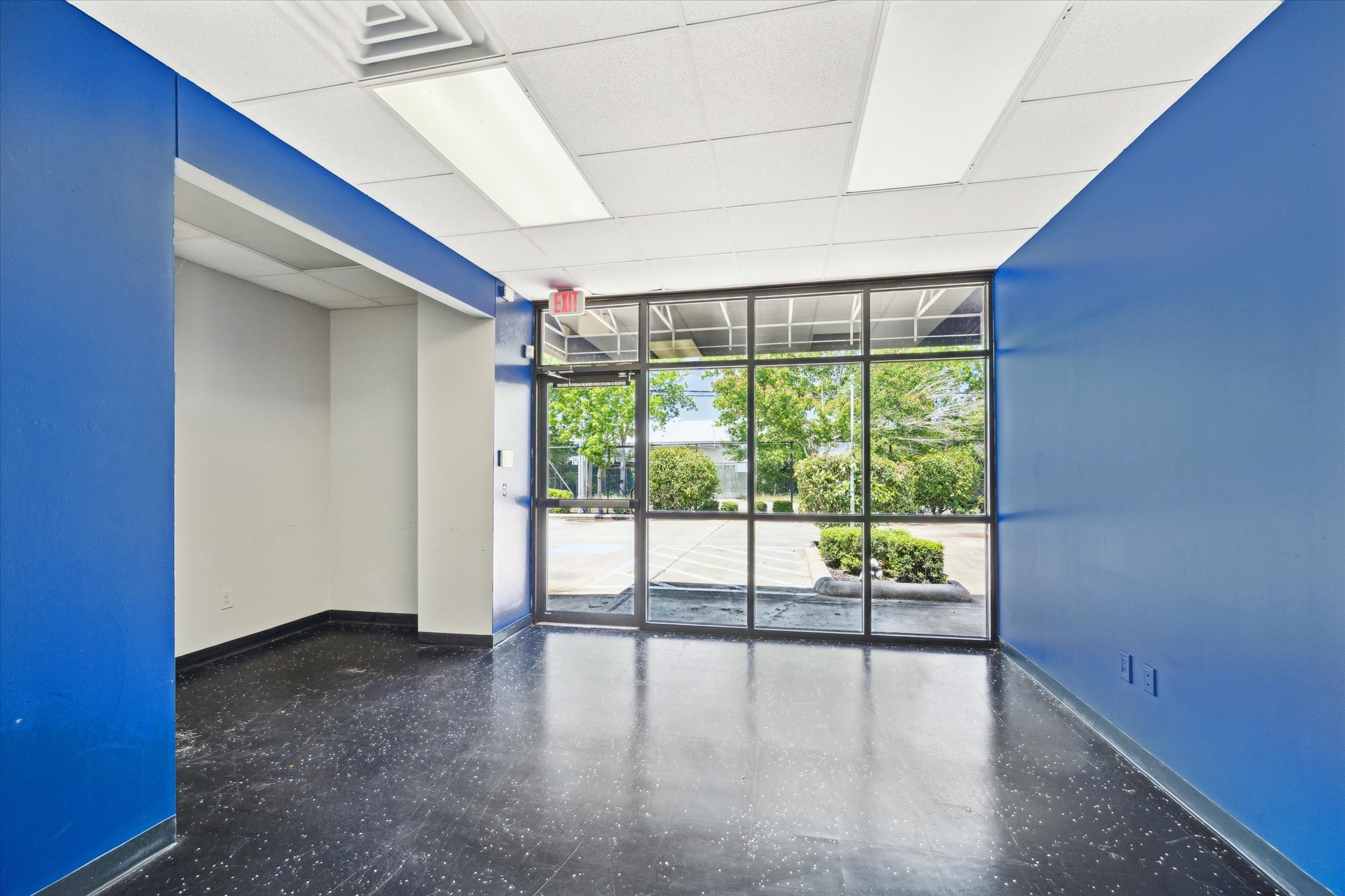 7001 Burkett Street Houston, TX 77021 - Photo 4 of 10 a view of an empty room with wooden floor and a window