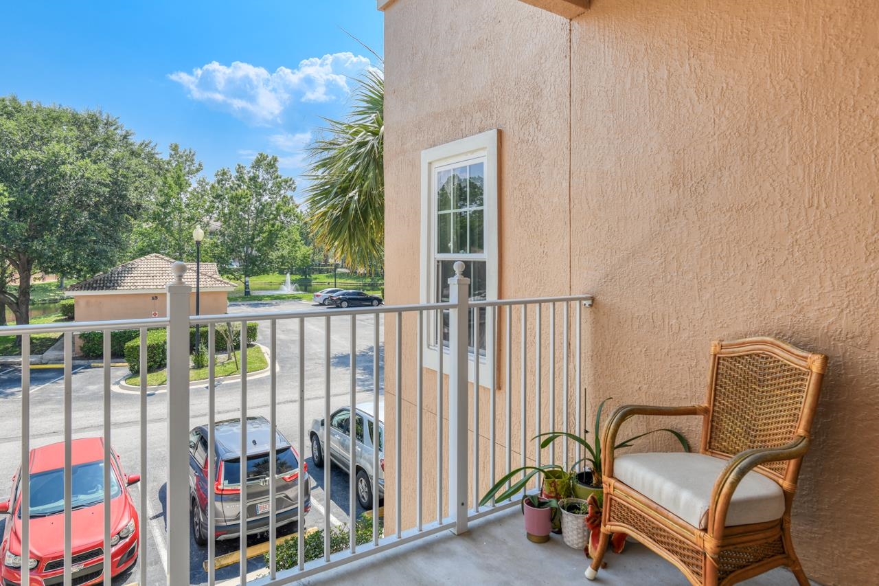 605 Fairway Drive, Unit 203 St. Augustine, FL 32084 - Photo 11 of 35 a view of a chair and tables in the balcony