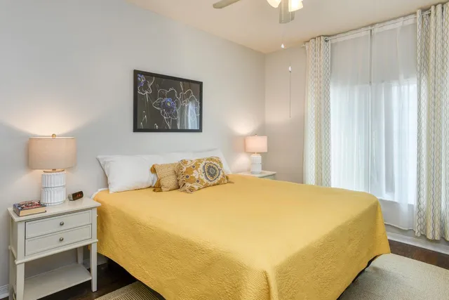 a bedroom with a bed and a night stand