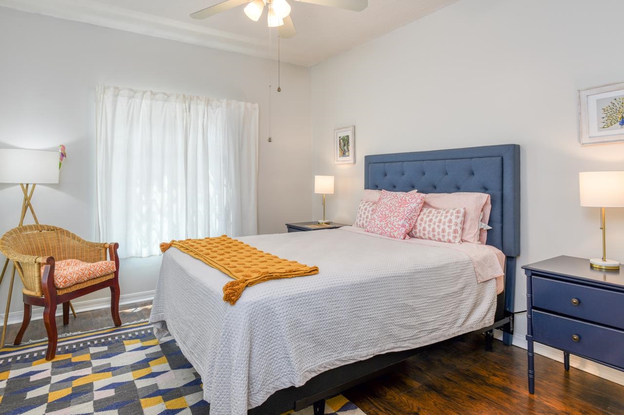 605 Fairway Drive, Unit 203 St. Augustine, FL 32084 - Photo 16 of 35 a bedroom with a bed and chair