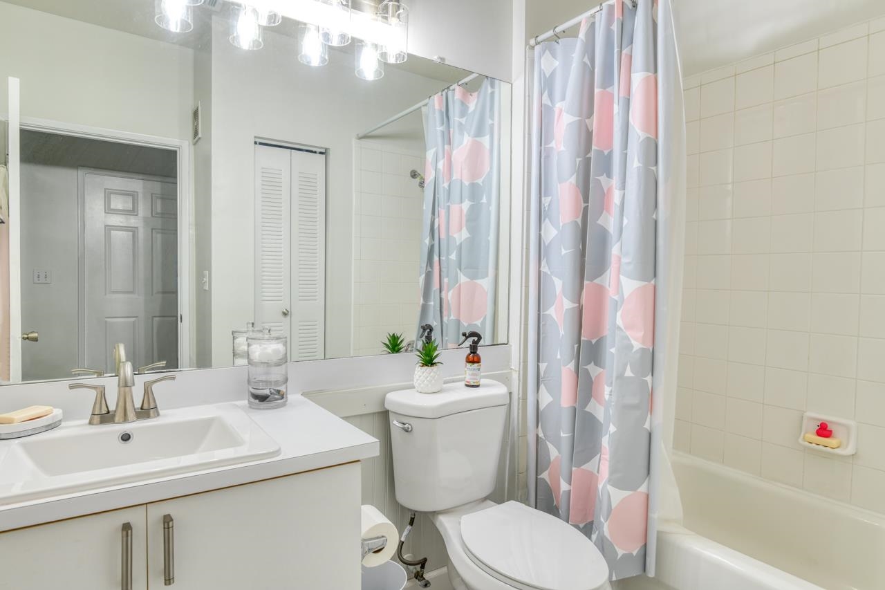 605 Fairway Drive, Unit 203 St. Augustine, FL 32084 - Photo 19 of 35 a bathroom with a sink toilet and shower