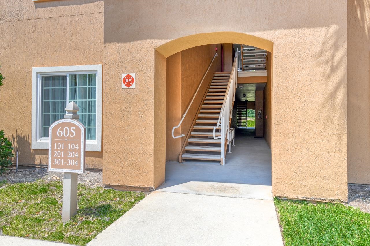 605 Fairway Drive, Unit 203 St. Augustine, FL 32084 - Photo 2 of 35 a view of entryway and hall with wooden floor