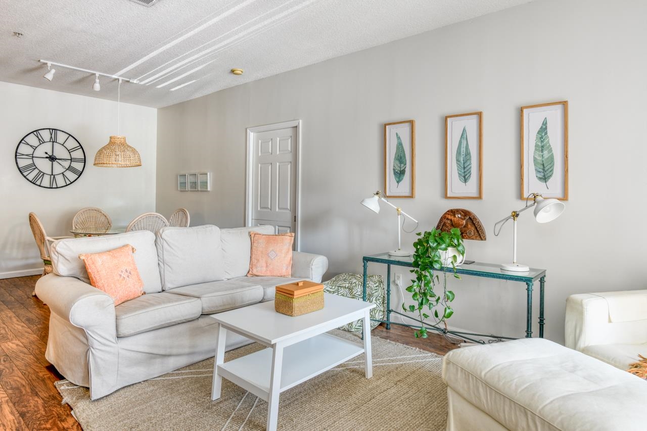 605 Fairway Drive, Unit 203 St. Augustine, FL 32084 - Photo 8 of 35 a living room with furniture and wooden floor