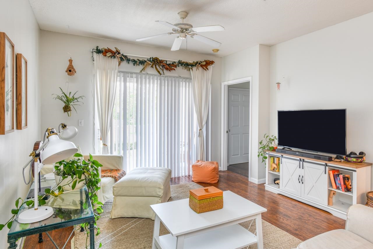 605 Fairway Drive, Unit 203 St. Augustine, FL 32084 - Photo 10 of 35 a living room with furniture and a flat screen tv