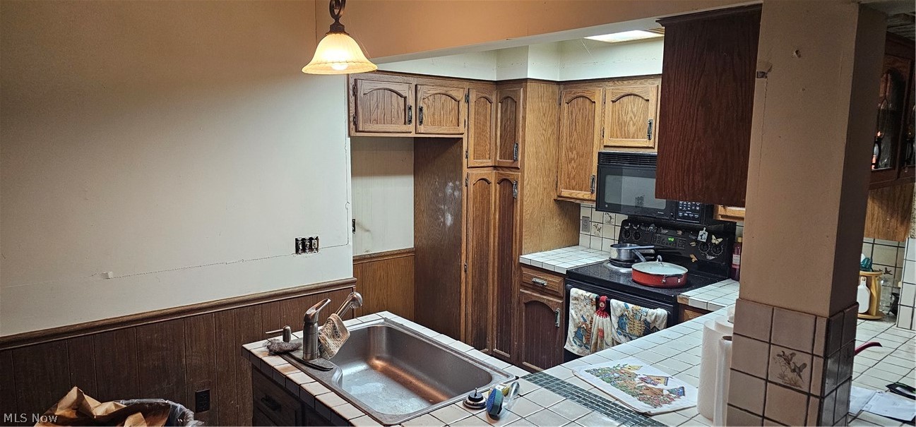 6162 Spieth Road Medina, OH 44256 - Photo 8 of 14 There is a island in the Kitchen were the sink is located. To the right is the breakfast bar.