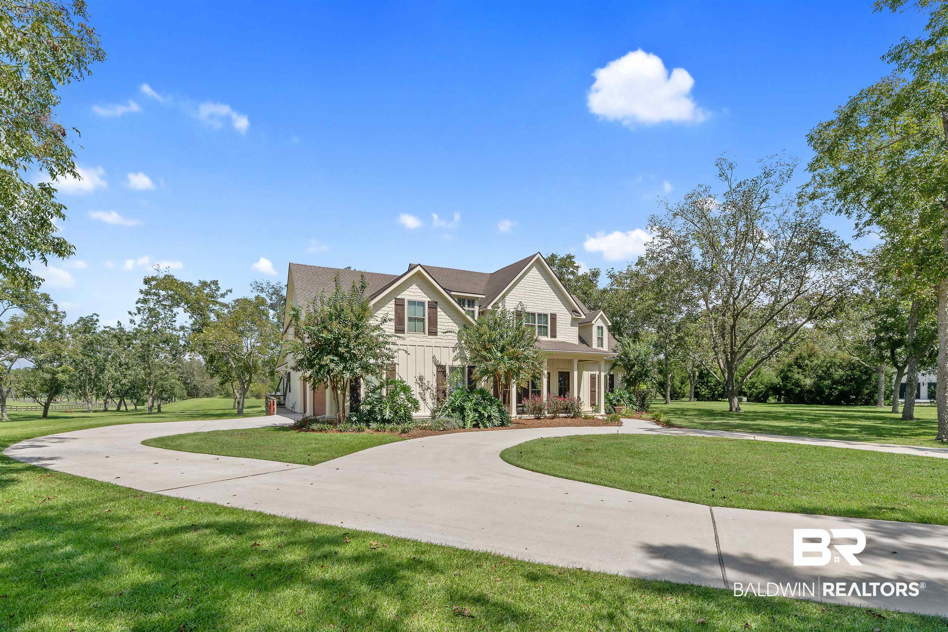 8753 Bishop Road Fairhope, AL 36532 - Photo 6 of 59 Expansive concrete driveway with a central island, providing extensive parking and access to the two-story residence