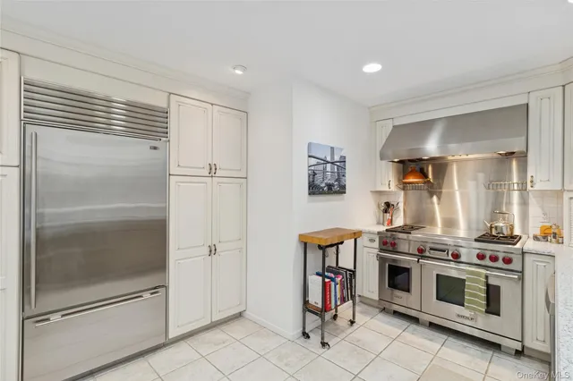 a kitchen that has a sink and a stove