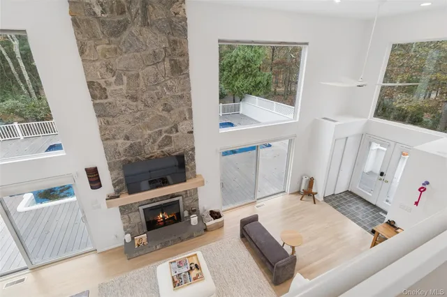a view of a bedroom with furniture and windows