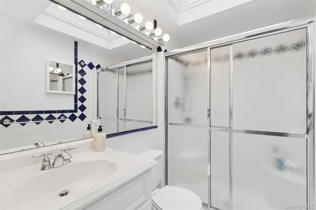 a bedroom with a bed a table and a dresser