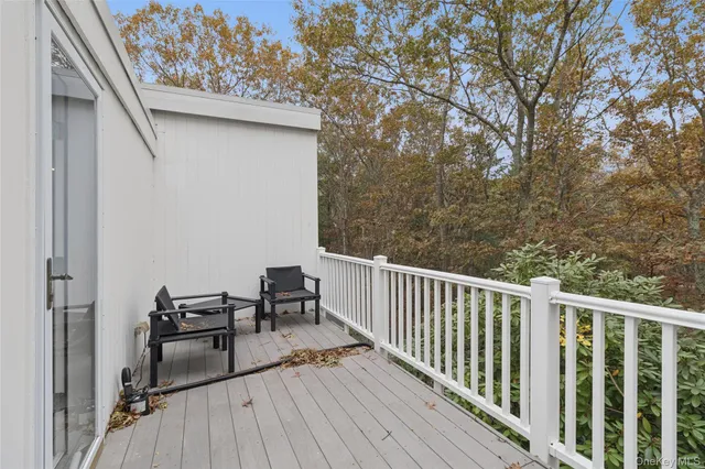 a bathroom with a sink vanity mirror and shower